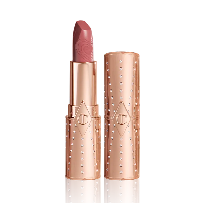 Charlotte Tilbury Wedding Belles lipstick in a soft rose-pink with a matte finish.