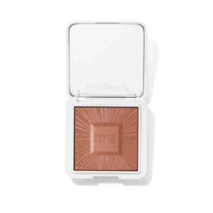 RMS Beauty Hydra Bronzer in Beachwalk Betty, presented in a silver metallic compact with a radiant bronzed shade inside.