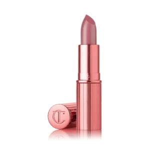 Charlotte Tilbury Icon Baby lipstick in a glossy nude-pink shade.